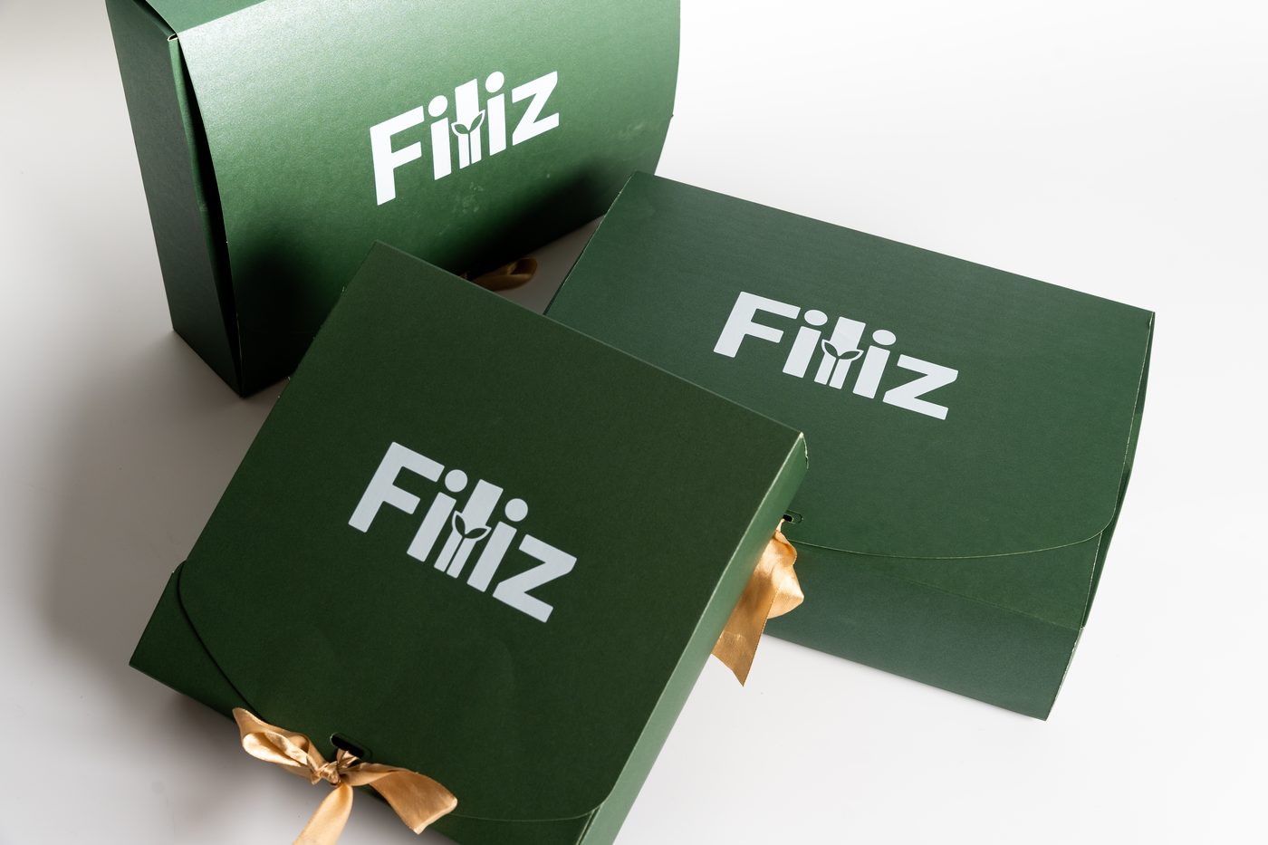 Stack of three returnable green Filiz boxes